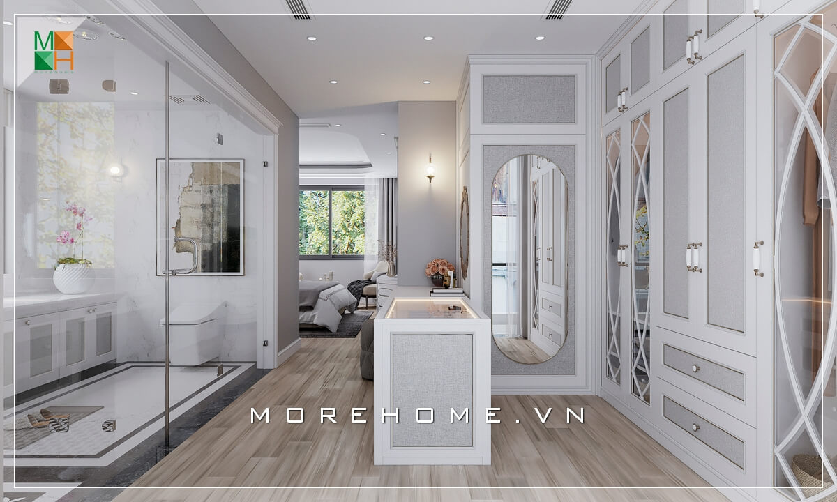 Morehome xin giới thiệu cho bạn mẫu phòng ngủ phong cách tân cổ điển với phòng thay đồ ở trung tâm giúp liên kết không gian phòng ngủ với phòng tắm, tận dụng triệt để diện tích sử dụng và mang lại sự thuận tiện cho sinh hoạt hàng ngày. Mẫu nội ngoại thất biệt thự tân cổ điển