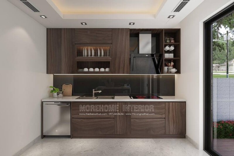 Mẫu tủ bếp với đường vân độc đáo cùng gỗ tối màu đã tạo nên không gian bếp hiện đại sang trọng. Thiết kế nội thất phòng bếp